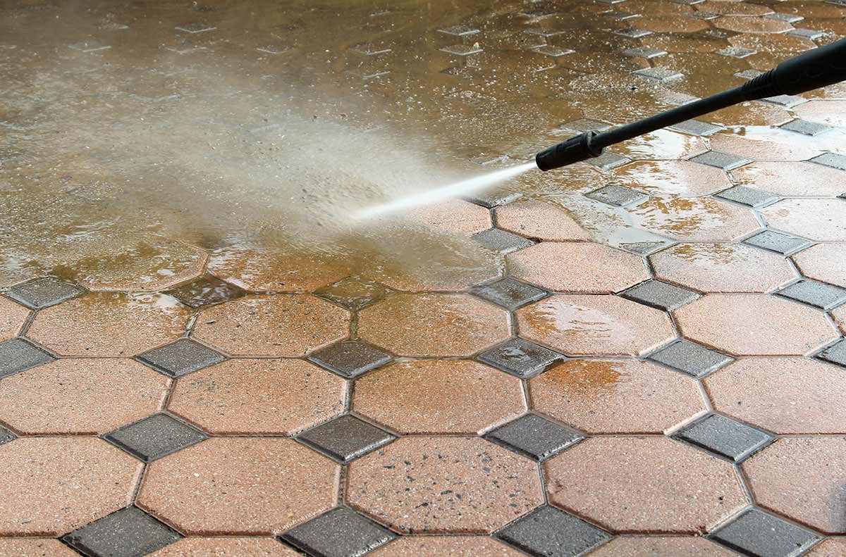 Stain removal with pressure washing