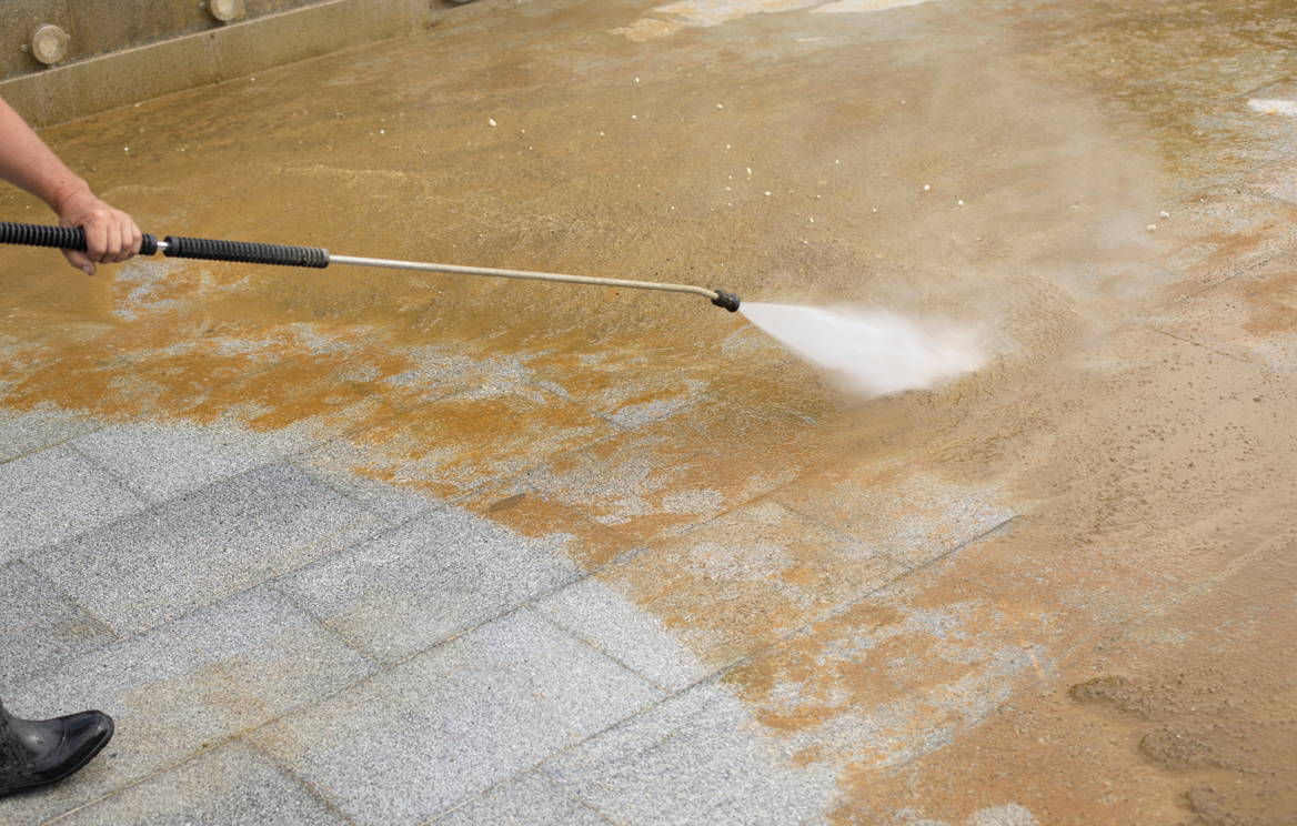 someone pressure washing