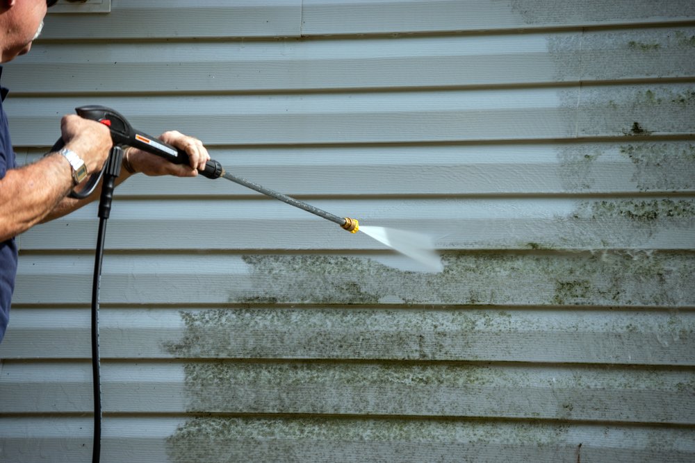 Stain removal with pressure washing